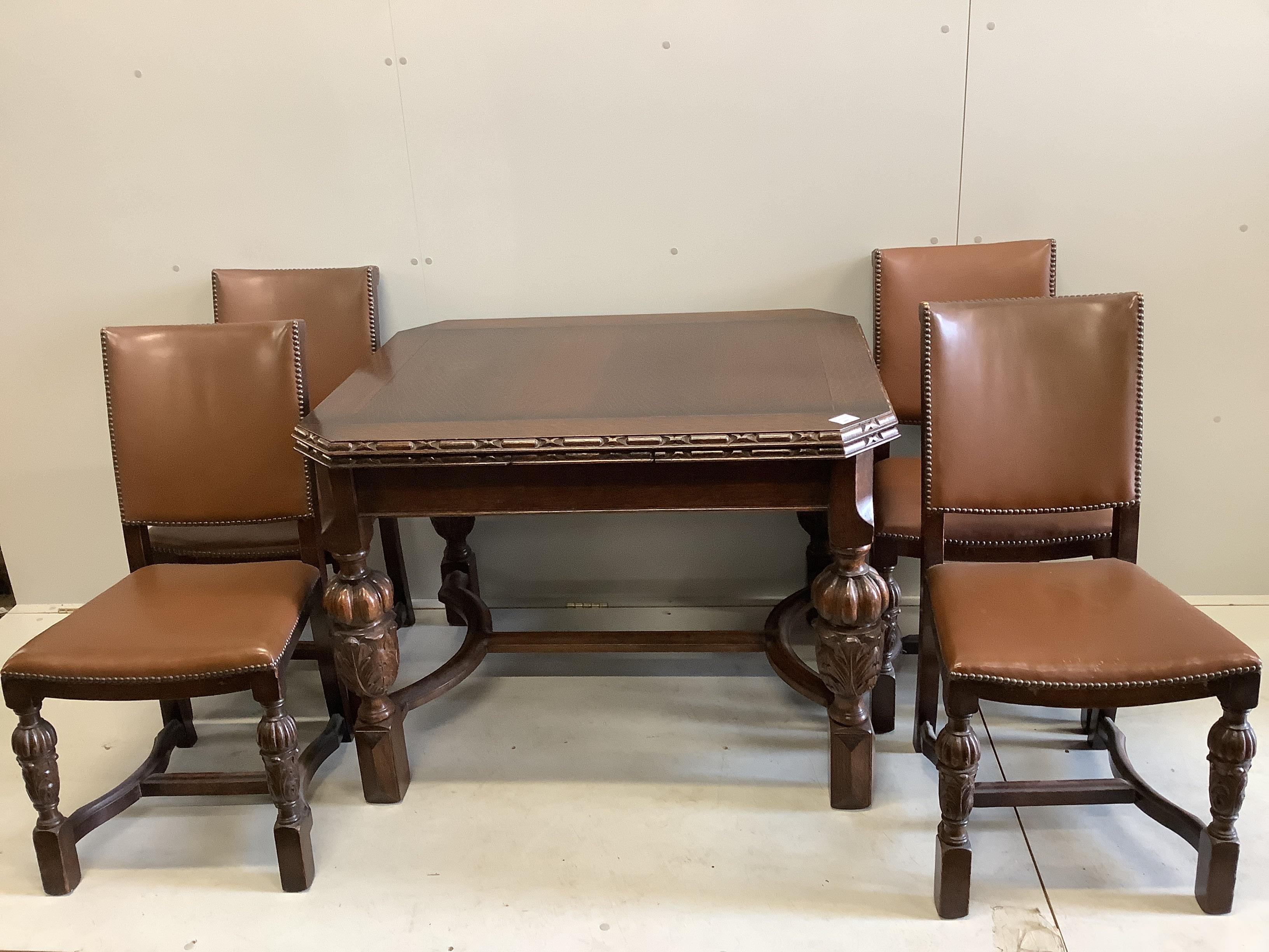 A Jacobean Revival oak draw leaf dining table, width 168cm extended, depth 83cm, height 76cm together with four matching single chairs